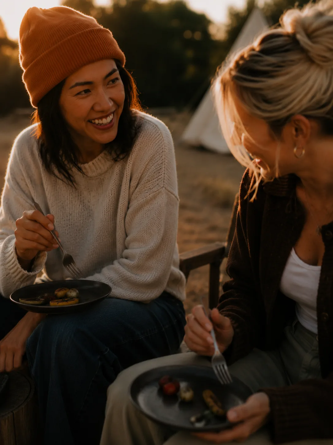 Refer a Friend campaign imagery: two friends sharing a meal at sunset. AI-generated, art directed by Michael James Clarke