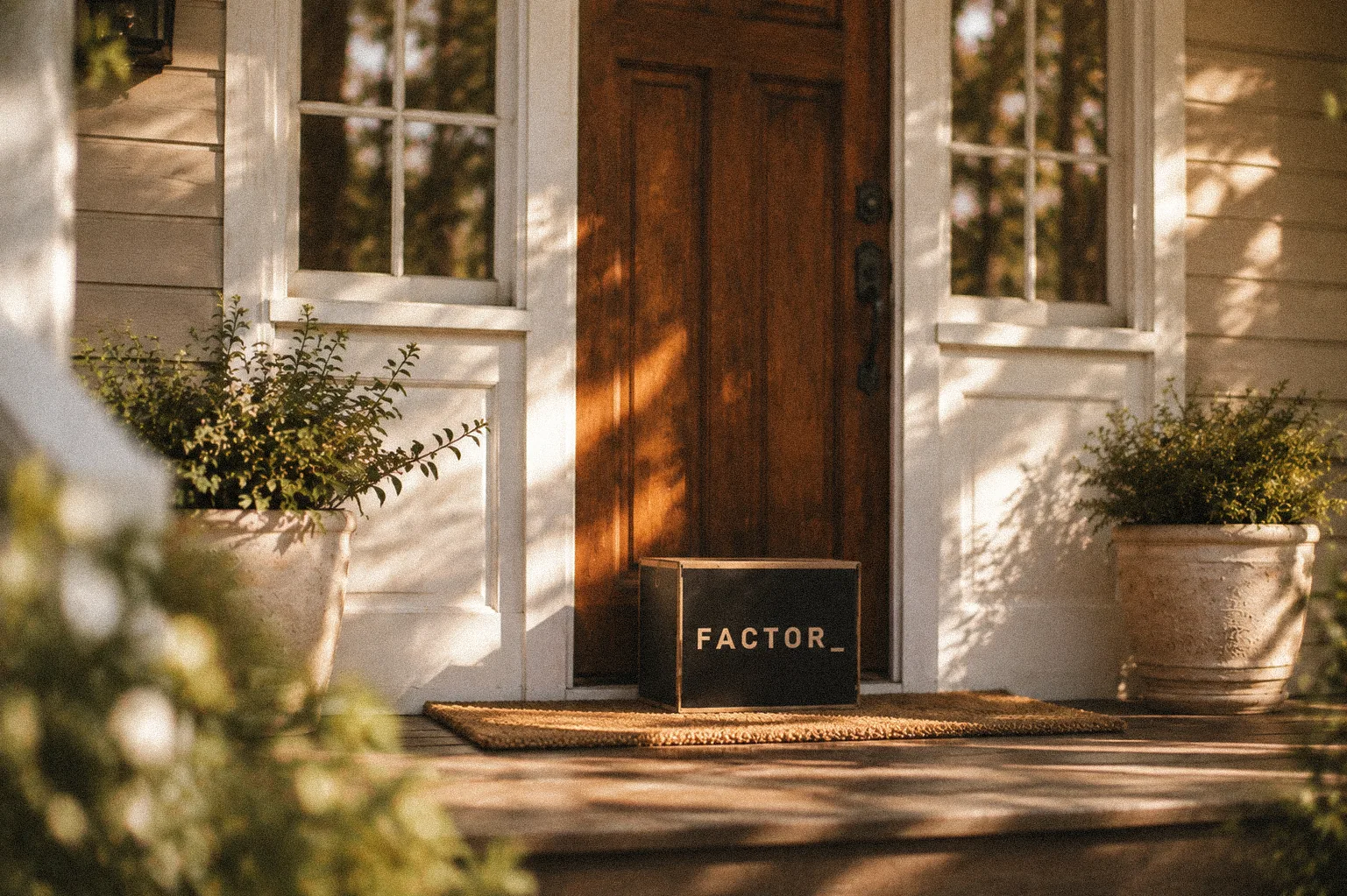 A Factor box waiting on a front porch in late afternoon light